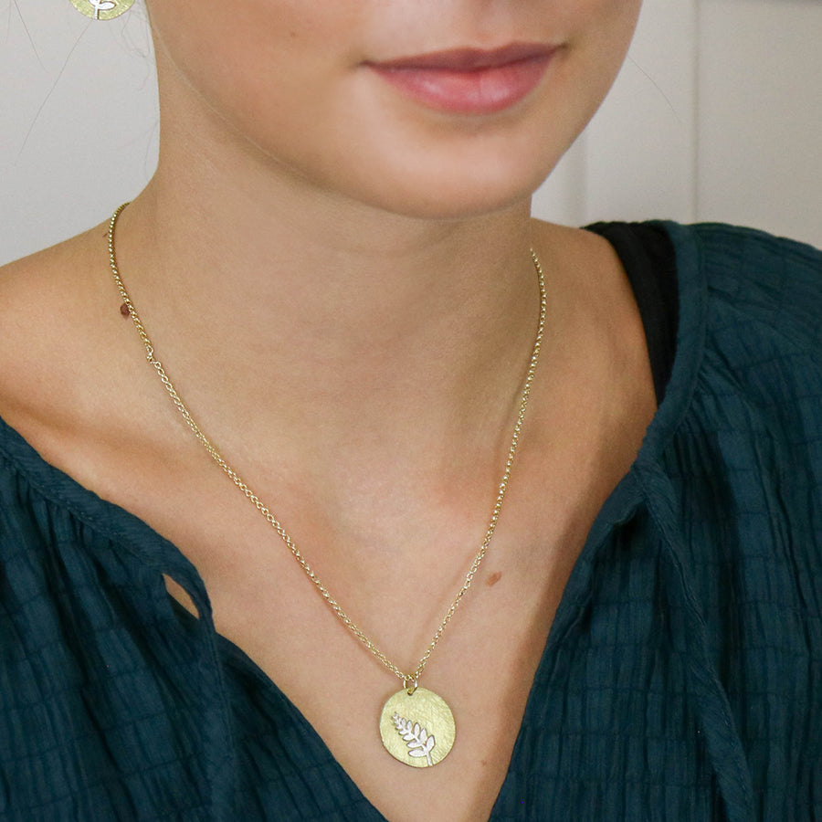 Faux Gold Scratched Disc Necklace with Silver Plated Fern Inlay