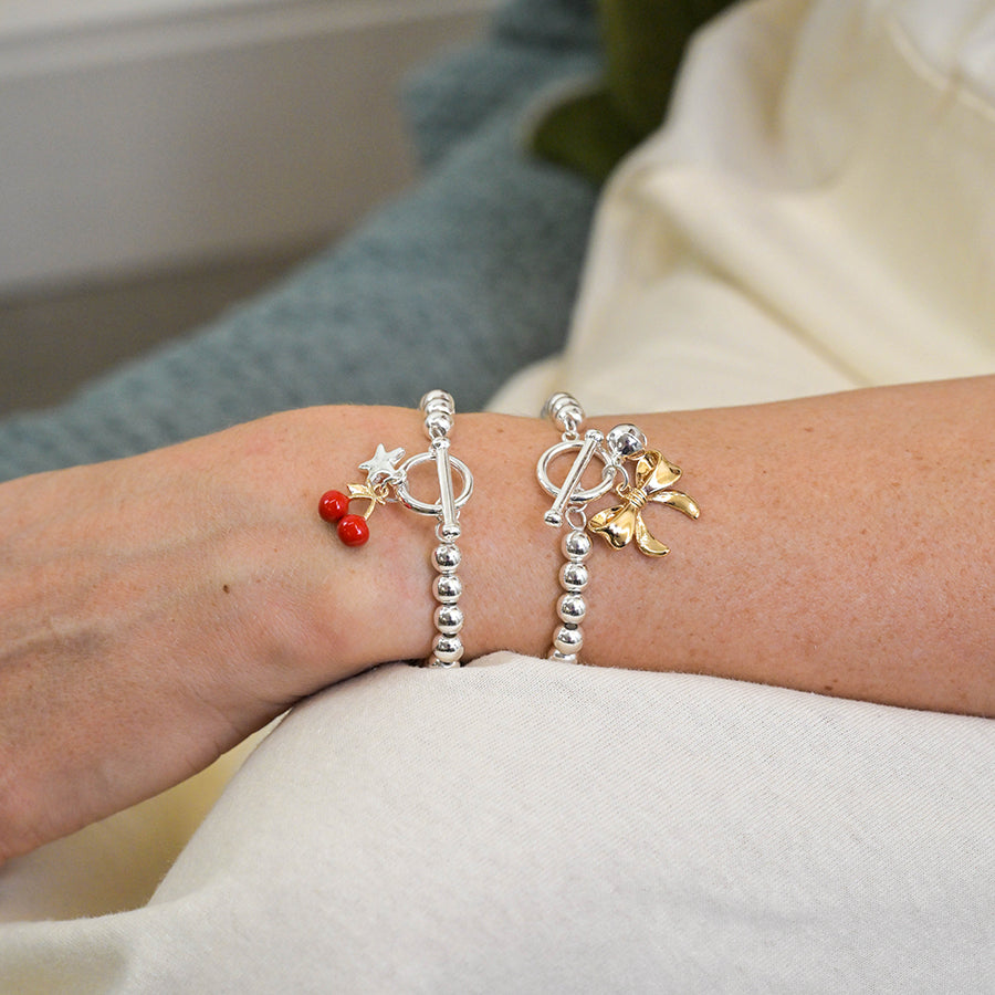 POM -Silver Plated Bell and Golden Bow Charm Bracelet